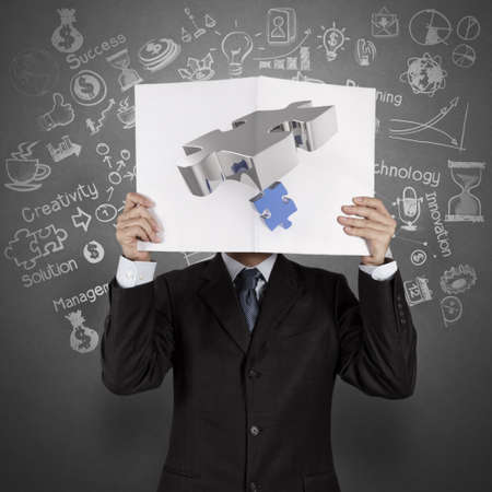 businessman hand show black cover book of partnership business as conceptの写真素材