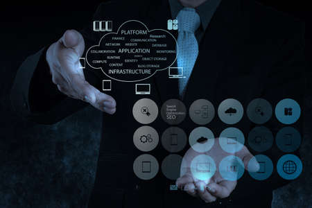 Businessman hand working with a Cloud Computing diagram on the new computer interface as conceptの写真素材