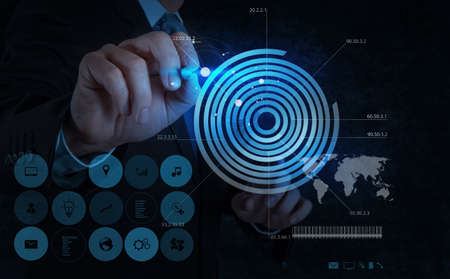 businessman hand drawing virtual chart business on modren computerの写真素材