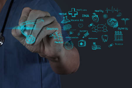 Medicine doctor hand working with modern computer interface as medical conceptの写真素材
