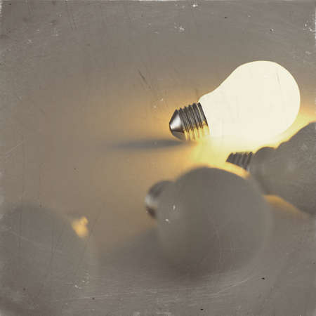 light bulb 3d on dark background as vintage styleの写真素材