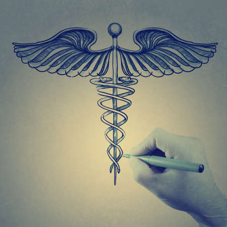 doctor hand draws Caduceus as vintage style conceptの写真素材
