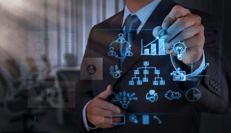 businessman hand working with new modern computer and business strategy as conceptの写真素材