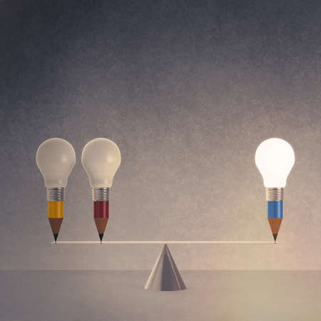 false balance of pencil lightbulb as vintage style conceptの写真素材