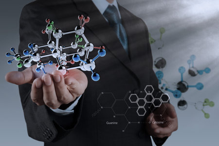 businessman holding a molecule as science conceptの写真素材