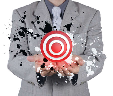 businessman hand shows target symbol and splash color as conceptの写真素材