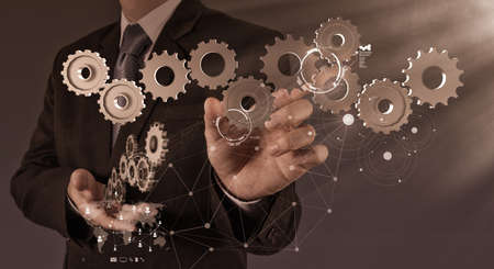 businessman hand show gear to success as conceptの写真素材