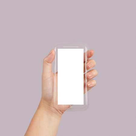 woman hand holding the phone tablet touch computer gadget as conceptの写真素材