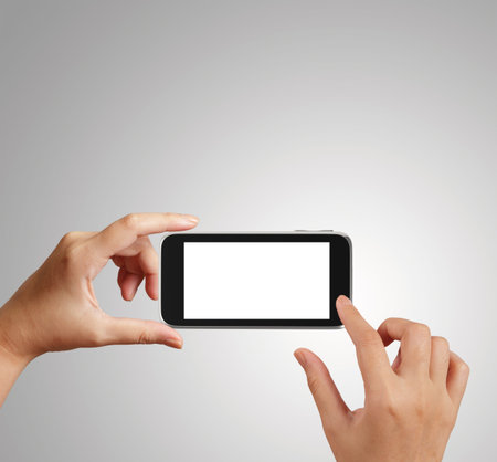 woman hand holding the phone tablet touch computer gadget as concept