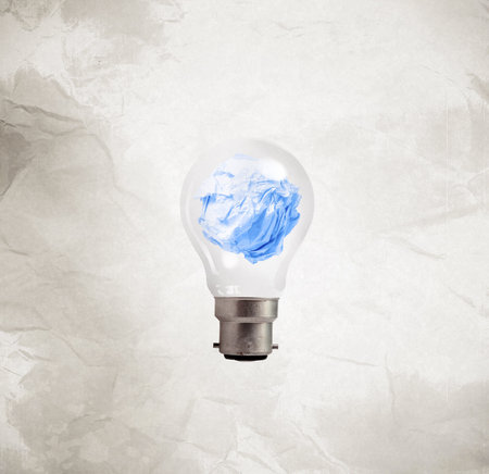light bulb crumpled paper on wrinkled paper as creative concept