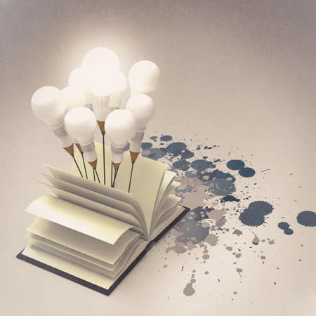 drawing idea pencil and light bulb concept outside the book with splash colors as creative conceptの写真素材