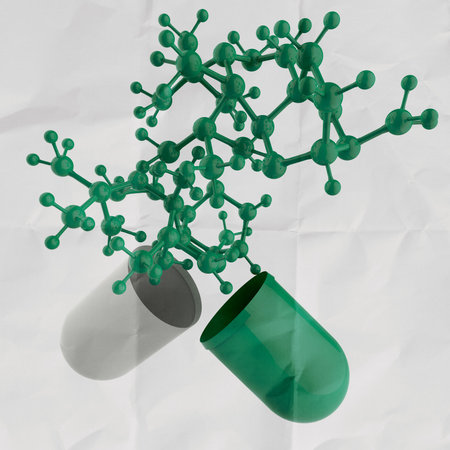 green medical capsule and molecule structure on crumpled paper as concept