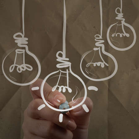 hand drawing light bulb with crumpled recycle paper as creative conceptの写真素材