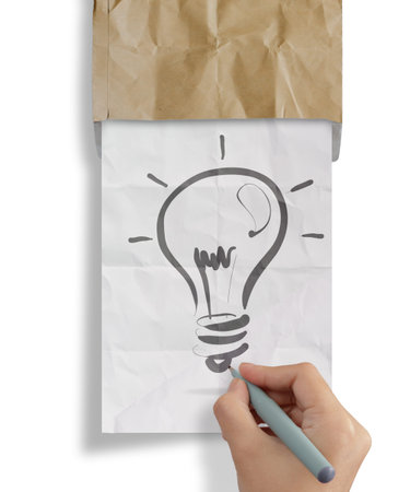 hand draws light bulb crumpled paperfrom recycle envelope as creative conceptの写真素材