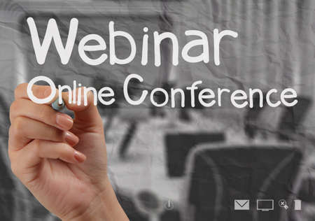 hand writing Webinar with crumpled paper background as conceptの写真素材
