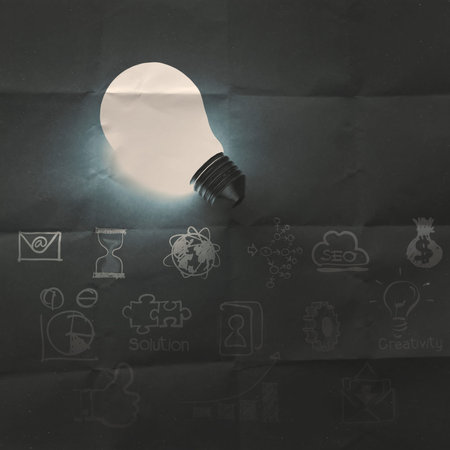 light bulb 3d on business strategy crumpled recycle paper background