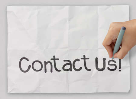 Hand writing Contact us as conceptの写真素材