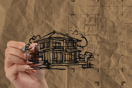 hand drawing house with wrinkled recycle paper as conceptの写真素材