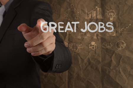 businessman hand draws great jobs words on crumpled recycle paper background as concept