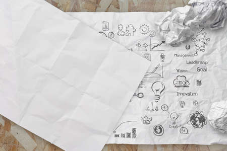 business concept on crumpled paper and sticky note background の写真素材