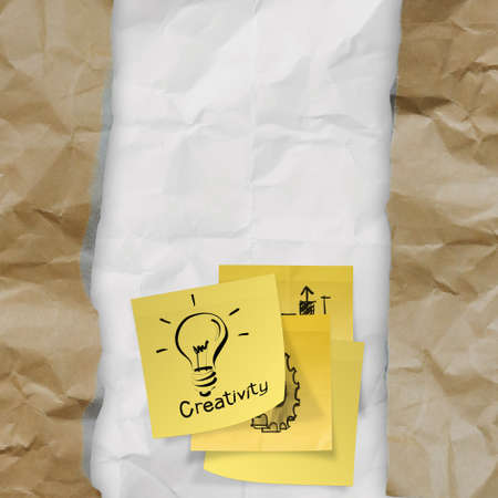 sticky note with  light bulb on crumpled paper as creative conceptの写真素材