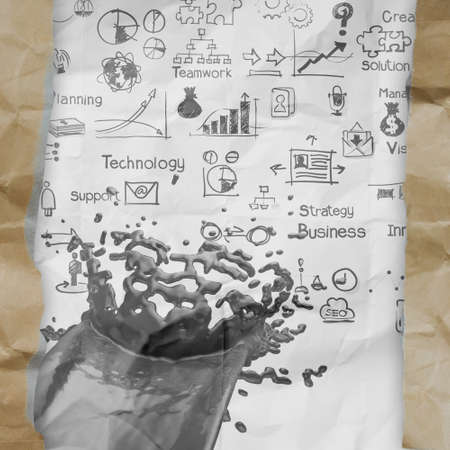hand drawn  business strategy splash on crumpled paper with tear envelope as conceptの写真素材
