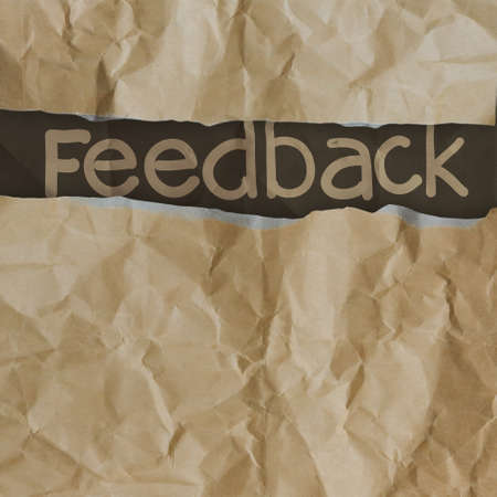 hand drawn feedback  words on crumpled paper with tear envelope as conceptの写真素材