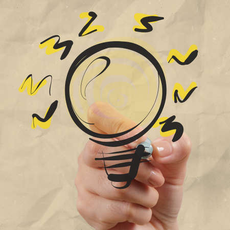 hand drawing light bulb with crumpled paper as creative conceptの写真素材