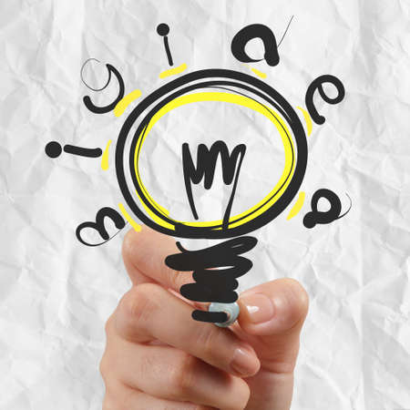hand drawing light bulb with crumpled paper as creative conceptの写真素材