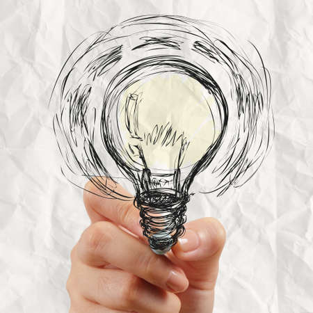 hand drawing light bulb with crumpled paper as creative conceptの写真素材