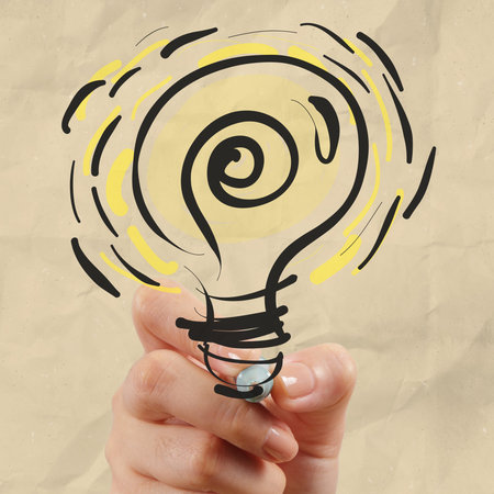 hand drawing light bulb with crumpled paper as creative conceptの写真素材