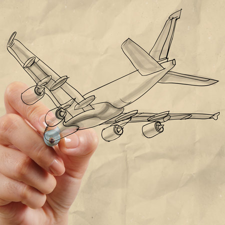 hand drawing airplane with crumpled paper background as conceptの写真素材