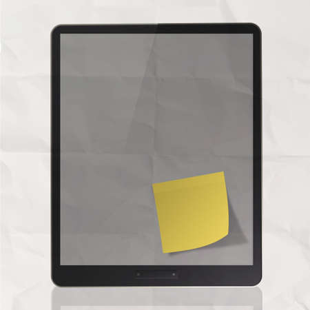 Black tablet pc on crumpled paper and sticky note as conceptの写真素材