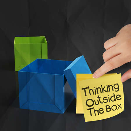 thinking outside the box on crumpled sticky note paper as conceptの写真素材