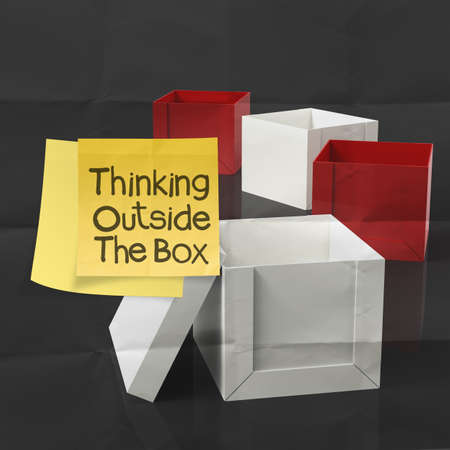 thinking outside the box on crumpled sticky note paper as conceptの写真素材