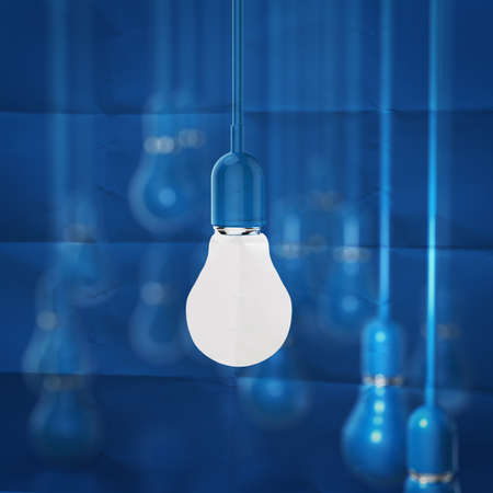 creative idea and leadership concept light bulb on crumpled paper backgroundの写真素材
