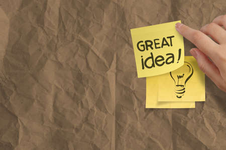 great idea words crumpled sticky note paper on texture paper as conceptの写真素材