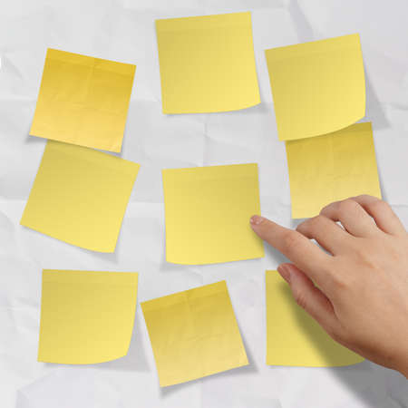 blank crumpled sticky note paper on texture paper as conceptの写真素材