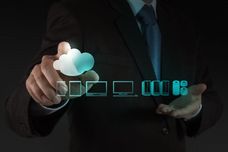 Businessman hand working with a Cloud Computing diagram on the new computer interface as concept