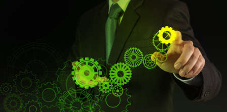 businessman hand draws gear to success conceptの写真素材