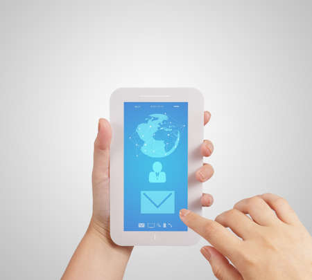 hand use Touch screen mobile phone with email icon as conceptの写真素材
