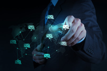 Businessman working with the new computer interface sending email as network concept