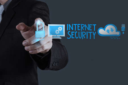 businessman hand touching Internet security online business as concept の写真素材