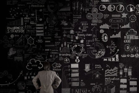 businessman looking business concept and strategy on dark texture wall background as concept