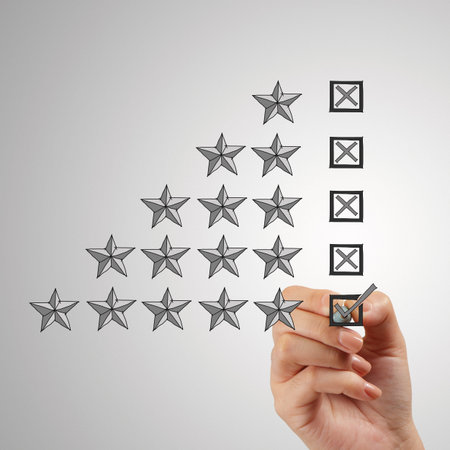 close up of hand putting check mark  on five star rating on screen as concept