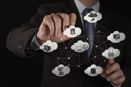Businessman hand working with a Cloud Computing diagram on the new computer interface as concept
