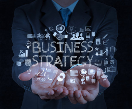 businessman hand working with new modern computer and business strategy as concept