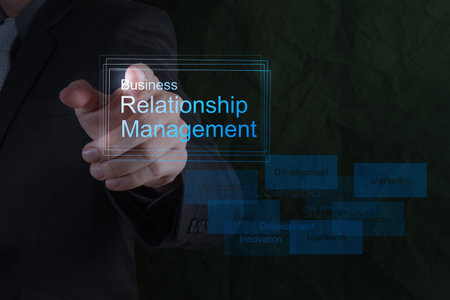 Businessman hand show business relationship management on the new computer interface as conceptの写真素材
