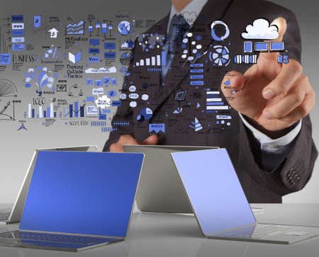 Businessman hand working with a Cloud Computing diagram on the new computer interface as conceptの写真素材