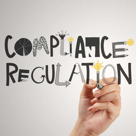 close of hand pointing to Compliance Regulation designwords as conceptの写真素材
